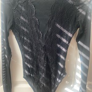 Black, lace body suit - long sleeve. Never worn, just don’t have tags.